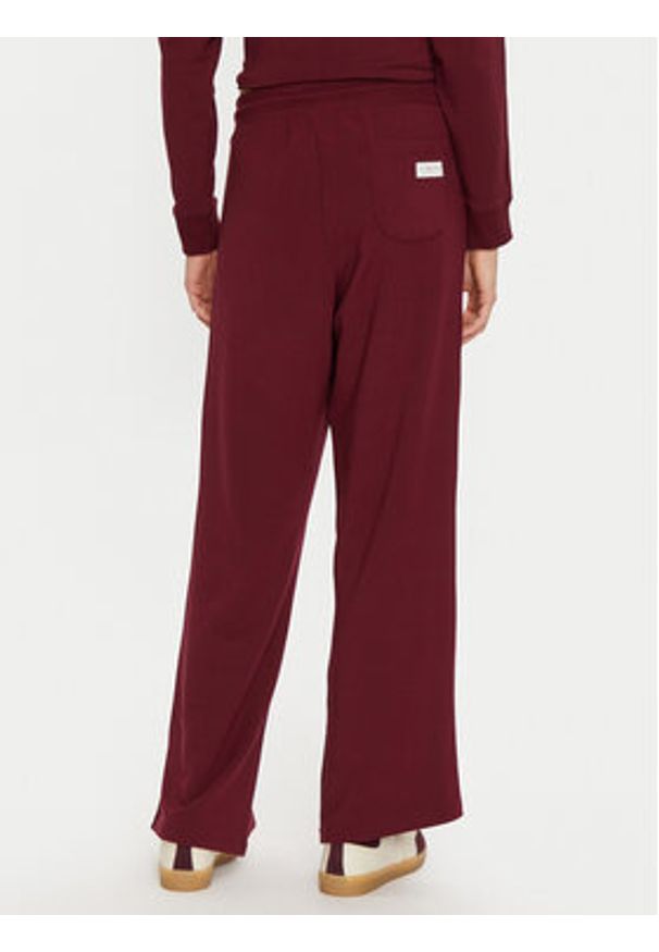 TOMMY HILFIGER - Tommy Hilfiger Spodnie dresowe UW0UW04771 Bordowy Relaxed Fit. Kolor: czerwony. Materiał: dresówka