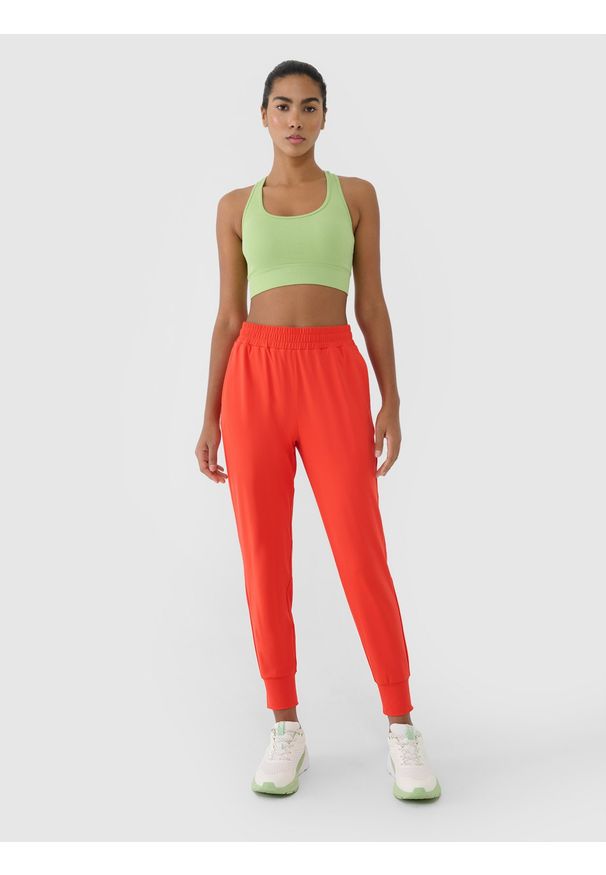 4f - 4F Spodnie treningowe szybkoschnące damskie - czerwone XXL. Kolor: czerwony. Materiał: dzianina, elastan, włókno, syntetyk, materiał. Wzór: jednolity, ze splotem. Sport: fitness