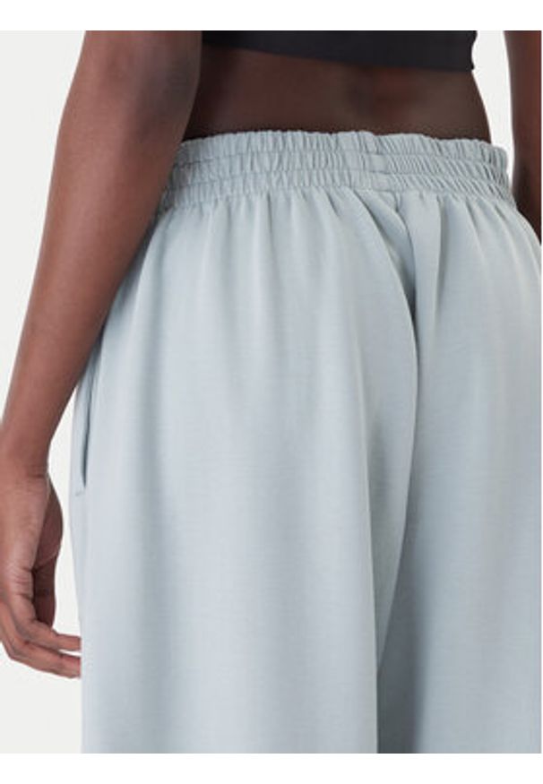 Adidas - adidas Spodnie dresowe Soft Lux KA7018 Zielony Loose Fit. Kolor: zielony. Materiał: syntetyk