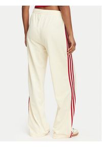 Adidas - adidas Spodnie dresowe Firebird Loose Tracksuit KS4671 Kremowy Loose Fit. Kolor: kremowy. Materiał: syntetyk #3