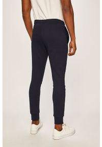 Lacoste - Spodnie XH9507. Kolor: niebieski. Materiał: bawełna, materiał, dzianina, elastan, poliester. Wzór: gładki #3