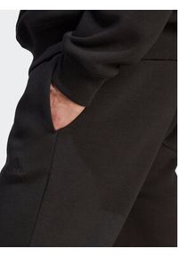 Adidas - adidas Spodnie dresowe All SZN Fleece IB4070 Czarny Regular Fit. Kolor: czarny. Materiał: bawełna #5
