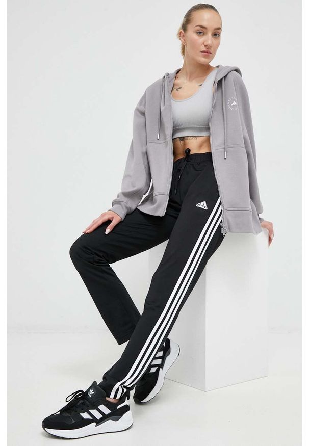 Adidas - adidas spodnie dresowe kolor czarny z aplikacją. Kolor: czarny. Materiał: dresówka. Wzór: aplikacja