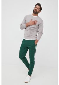 Lacoste spodnie męskie kolor zielony gładkie. Kolor: zielony. Wzór: gładki