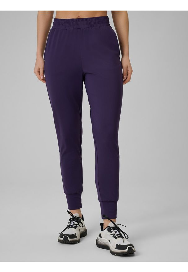 4f - 4F Spodnie treningowe szybkoschnące damskie - fioletowe L. Kolor: fioletowy. Materiał: włókno. Sport: fitness