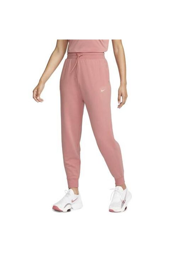 Spodnie sportowe męskie Nike FB5434618. Kolor: różowy, wielokolorowy. Materiał: dresówka. Sport: turystyka piesza