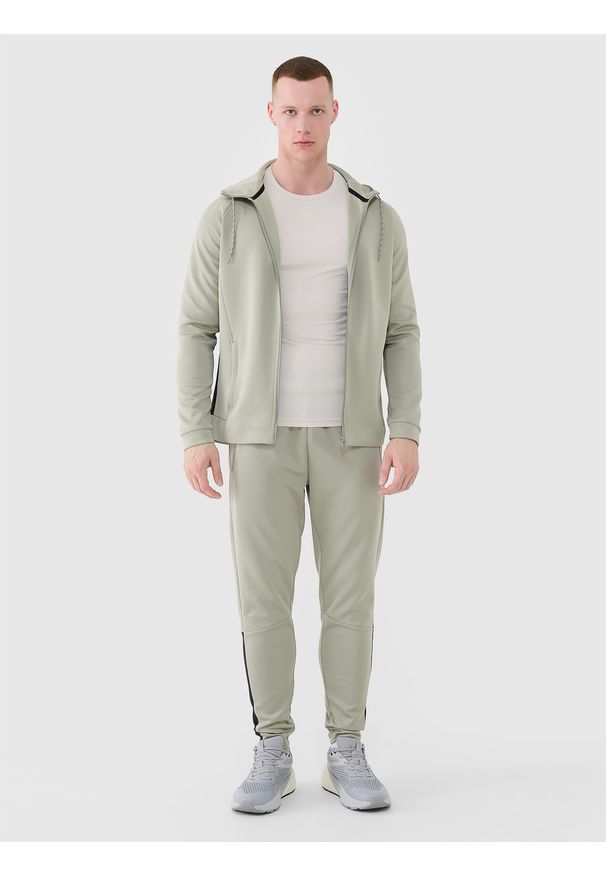 4f - 4F Spodnie treningowe szybkoschnące męskie - khaki M. Kolor: oliwkowy, brązowy, wielokolorowy. Materiał: dzianina, dresówka, włókno, syntetyk, materiał, elastan. Wzór: ze splotem, jednolity. Sport: fitness