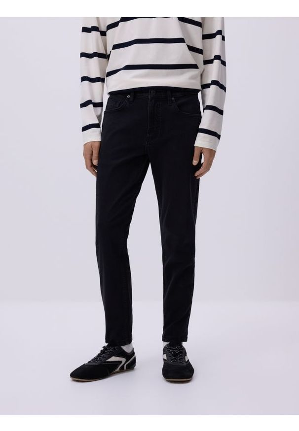 Reserved - Jeansy skinny z efektem sprania - czarny. Kolor: czarny