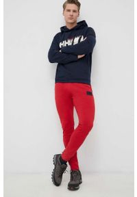 Helly Hansen spodnie dresowe kolor czerwony gładkie. Kolor: czerwony. Materiał: dresówka. Wzór: gładki #3
