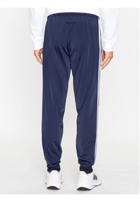 Adidas - adidas Spodnie dresowe Essentials Warm-Up 3-Stripes H46106 Granatowy Regular Fit. Kolor: niebieski. Materiał: syntetyk #3