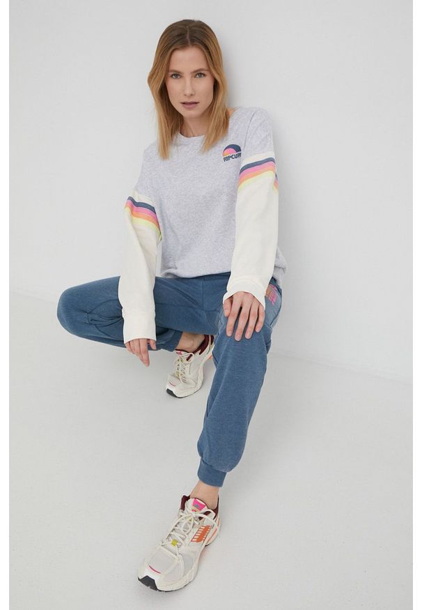 Rip Curl spodnie dresowe damskie kolor turkusowy z nadrukiem. Stan: podwyższony. Kolor: turkusowy. Materiał: dresówka. Wzór: nadruk