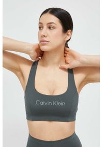 Calvin Klein Performance biustonosz sportowy Essentials kolor zielony. Kolor: zielony. Materiał: skóra. Sport: fitness, taniec #1