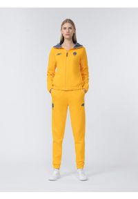 4f - Spodnie dresowe joggery damskie Litwa - Pekin 2022. Kolor: żółty. Materiał: dresówka. Sezon: zima