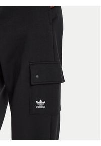 Adidas - adidas Spodnie dresowe Essentials IT7576 Czarny Loose Fit. Kolor: czarny. Materiał: bawełna, syntetyk #3