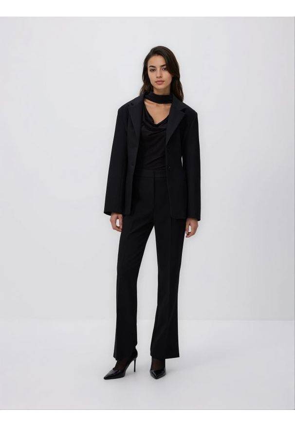 Reserved - Spodnie z rozcięciem - czarny. Kolor: czarny. Materiał: tkanina, wiskoza