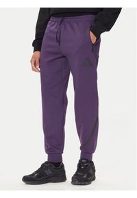 Adidas - adidas Spodnie dresowe Z.N.E. JW4726 Fioletowy Loose Fit. Kolor: fioletowy. Materiał: bawełna