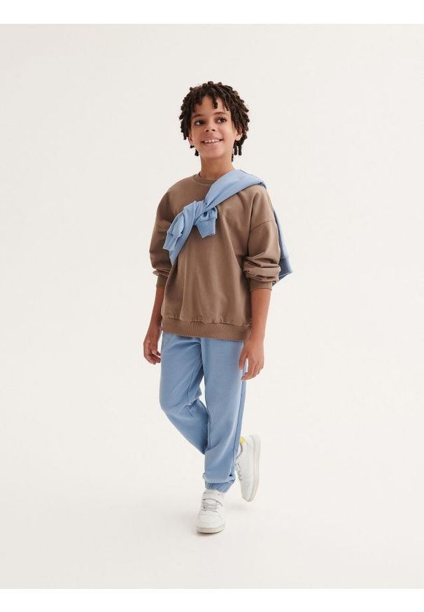 Reserved - Dresowe spodnie jogger - niebieski. Kolor: niebieski. Materiał: dresówka