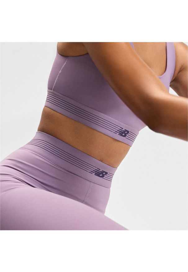 Legginsy damskie do treningu New Balance AC WB6160E1AA5 – fioletowe. Stan: podwyższony. Kolor: fioletowy. Materiał: poliester, materiał, lycra. Wzór: gładki. Sport: fitness