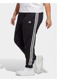 Adidas - adidas Spodnie dresowe Essentials 3-Stripes French Terry Cuffed Joggers (Plus Size) IB8745 Czarny Slim Fit. Kolekcja: plus size. Kolor: czarny. Materiał: bawełna #1