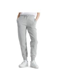 Spodnie New Balance WP43805AG - szare. Stan: podwyższony. Kolor: szary. Materiał: dresówka, bawełna, poliester