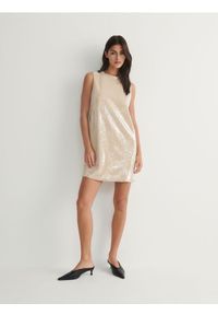 Reserved - Sukienka mini z cekinami - kremowy. Kolor: kremowy. Materiał: dzianina. Wzór: aplikacja. Typ sukienki: w kształcie A. Długość: mini