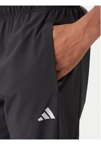 Adidas - adidas Spodnie dresowe Training Essentials Holiday JM5441 Czarny Regular Fit. Kolor: czarny. Materiał: syntetyk #2