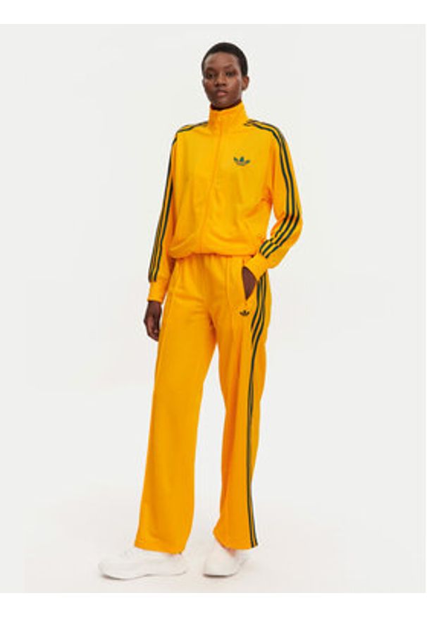 Adidas - adidas Spodnie dresowe adicolor Classic Firebird JP2316 Żółty Loose Fit. Kolor: żółty. Materiał: syntetyk