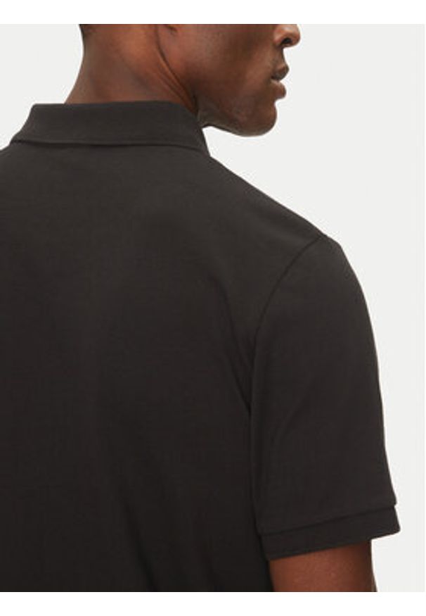 The North Face Polo Essential NF0A8C1P Czarny Regular Fit. Typ kołnierza: polo. Kolor: czarny. Materiał: bawełna