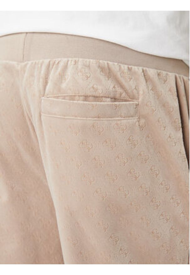 Guess Spodnie dresowe Z6RB14 KD612 Beżowy Regular Fit. Kolor: beżowy. Materiał: syntetyk