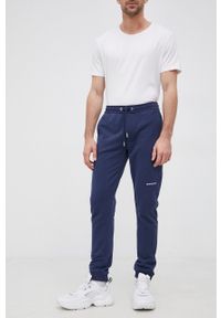 Calvin Klein Jeans Spodnie bawełniane męskie kolor granatowy gładkie. Kolor: niebieski. Materiał: bawełna. Wzór: gładki