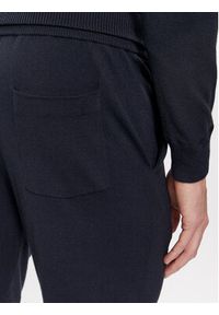 TOMMY HILFIGER - Tommy Hilfiger Spodnie dresowe UM0UM03003 Granatowy Regular Fit. Kolor: niebieski. Materiał: wiskoza