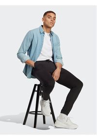 Adidas - adidas Spodnie dresowe Essentials Single Jersey Tapered Elasticized Cuff Logo Joggers IC0055 Czarny Regular Fit. Kolor: czarny. Materiał: bawełna #2