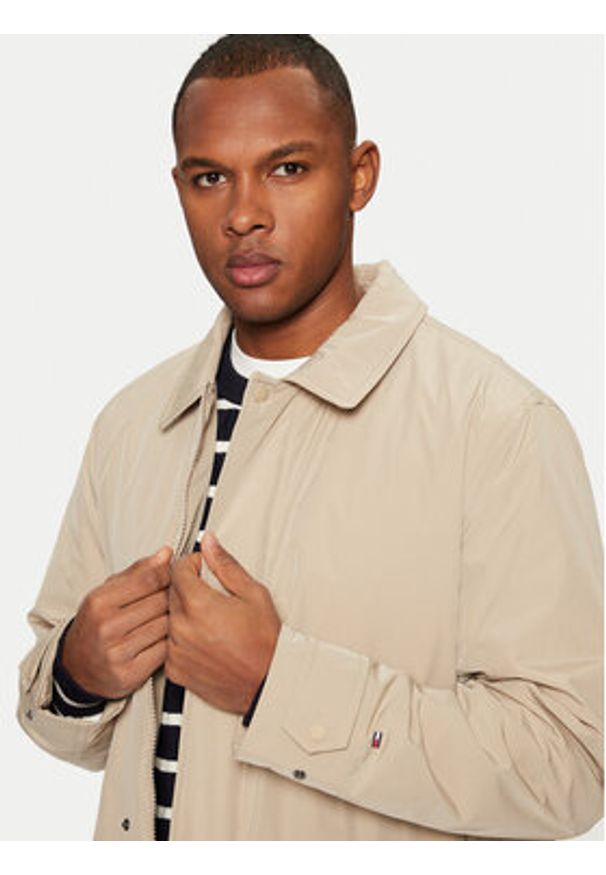 TOMMY HILFIGER - Tommy Hilfiger Płaszcz przejściowy MW0MW37651 Beżowy Regular Fit. Kolor: beżowy. Materiał: syntetyk