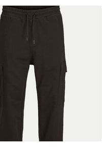 Jack & Jones - Jack&Jones Spodnie dresowe Kane 12263074 Czarny Relaxed Fit. Kolor: czarny. Materiał: bawełna