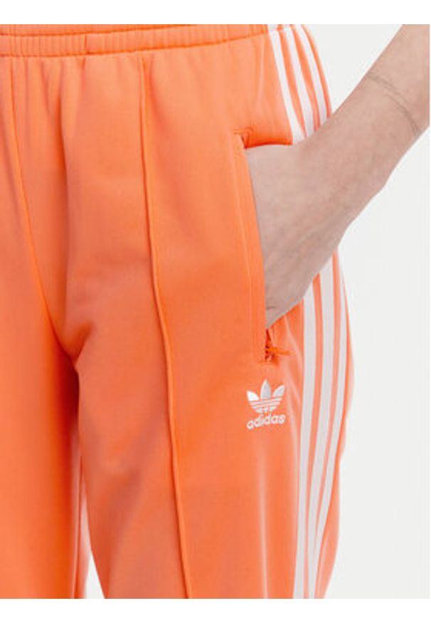 Adidas - adidas Spodnie dresowe adicolor Classics Firebird JC8286 Pomarańczowy Regular Fit. Kolor: pomarańczowy. Materiał: syntetyk