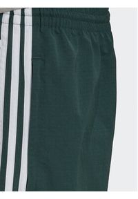 Adidas - adidas Spodnie dresowe adicolor 3 Stripes HN6736 Zielony Relaxed Fit. Kolor: zielony. Materiał: dresówka, syntetyk #6