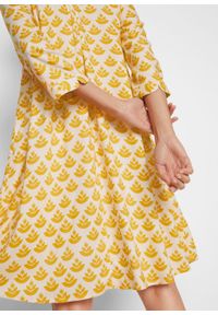 Sukienka tunikowa z dekoltem w serek i koronkową wstawką bonprix żółty curry - beżowo-szary z nadrukiem. Typ kołnierza: dekolt w serek. Kolor: żółty. Materiał: koronka. Wzór: nadruk #2