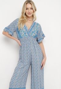 Born2be - Niebieski Bawełniany Kombinezon z Gumkami w Pasie i Kopertowym Dekoltem Zapinany z Tyłu na Guziki Lorrania. Okazja: na co dzień. Kolor: niebieski. Materiał: bawełna. Długość rękawa: krótki rękaw. Długość: krótkie. Styl: wizytowy, casual, elegancki #6