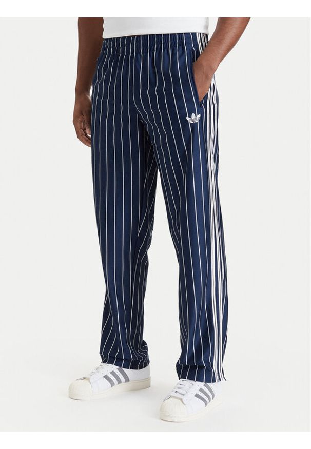 Adidas - adidas Spodnie dresowe Firebird Pinstripes Track Pants KR7231 Granatowy Regular Fit. Kolor: niebieski. Materiał: syntetyk