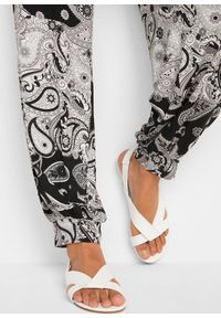 bonprix - Dżersejowe spodnie haremki z lejącej mieszanki wiskozy. Kolor: czarny. Materiał: jersey, wiskoza. Wzór: nadruk, paisley #2