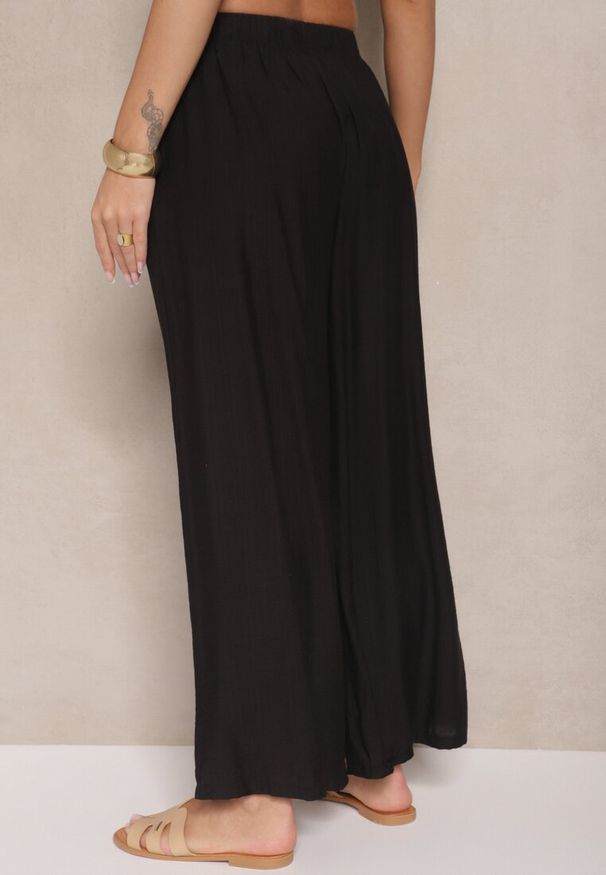 Renee - Czarne Spodnie Palazzo o Szerokim Kroju High Waist Lislevia. Okazja: na co dzień. Stan: podwyższony. Kolor: czarny. Styl: elegancki, casual