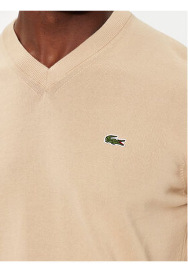 Lacoste Sweter AH1951 Beżowy Regular Fit. Kolor: beżowy. Materiał: bawełna