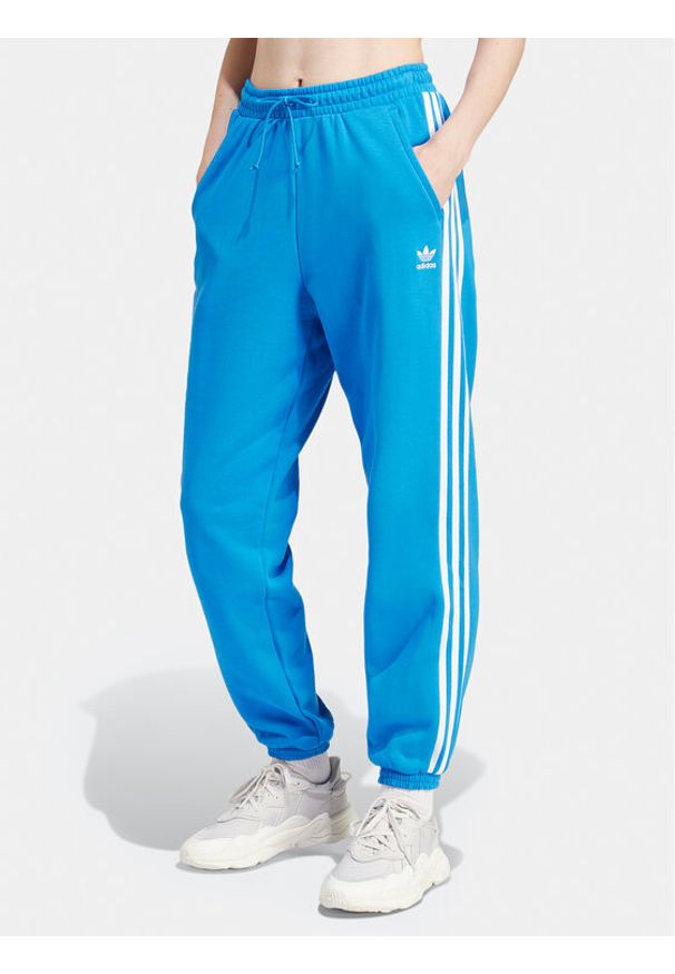 Adidas - adidas Spodnie dresowe adicolor Classics 3-Stripes IR8092 Niebieski Regular Fit. Kolor: niebieski. Materiał: bawełna