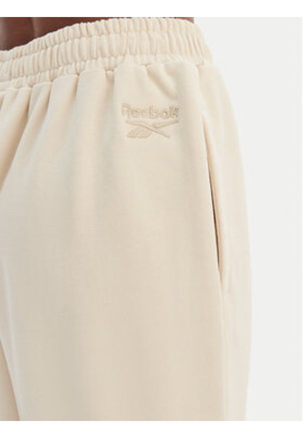 Reebok Spodnie dresowe Reebok x Ewa Chodakowska RK25624CCW Beżowy Wide Leg. Kolor: beżowy. Materiał: syntetyk