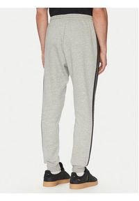 Adidas - adidas Spodnie dresowe Essentials 3-Stripes JE6318 Szary Regular Fit. Kolor: szary. Materiał: syntetyk, bawełna #3