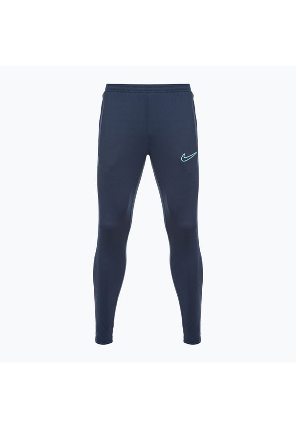 Spodnie piłkarskie męskie Nike Dri-Fit Academy. Kolor: niebieski. Materiał: dresówka. Technologia: Dri-Fit (Nike). Sport: piłka nożna