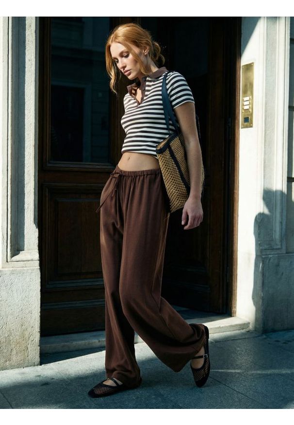 Sinsay - Spodnie wide leg z wiskozą - żółty. Kolor: żółty