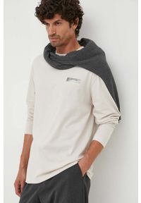 Calvin Klein longsleeve bawełniany kolor beżowy z nadrukiem. Kolor: beżowy. Materiał: bawełna. Długość rękawa: długi rękaw. Wzór: nadruk