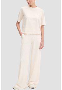 Guess - GUESS Kremowy bawełniany t-shirt damski Colette Boxy, Rozmiar L. Okazja: na co dzień. Kolor: beżowy. Materiał: bawełna. Styl: casual, sportowy #4