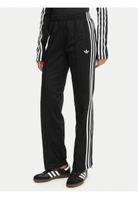 Adidas - adidas Spodnie dresowe Firebird Classic KD5575 Czarny Regular Fit. Kolor: czarny. Materiał: syntetyk #1